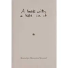 KNYGA Kamelya Omayma Youssef book with a hole in it