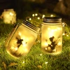 Butterfly Fairy saulės stiklo žibintai, 2 vnt. pakabinamų saulės žibintų laukui, saulės žibintai sodo apšvietimui, vandeniui atsparus sodo šviestuvas naudojimui lauke namų vakarėliams, sodui (warm)