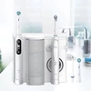 Oral-b Oral Health Center burnos irigatorius su Oxyjet technologija dantų valymui, 2 keičiami antgaliai ir Io Series 6 elektrinis dantų šepetėlis, 2 keičiami šepetėliai, 5 režimai dantų priežiūrai, baltas