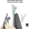 Umbra Buddy kabliukai, dekoratyviniai sieniniai kabliukai paltams, šalikams, krepšiams, kuprinėms, rankšluosčiams ir kt., 3 vnt. rinkinys, įvairių spalvų