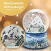 Minium Collection sniego gaublys žiemos kalėdų kalnų peizažas su tiltu, pagrindas – žiemos peizažas šviesiai mėlynas, su muzikos dėžute, aukštis 14 cm, plotis 10 cm, purtomas kamuolys 20256