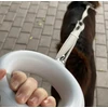 Doggy Village LUMINOUS Pavadėlis - stiprus 3 viename pavadėlis su LED žibintuvėliu, spalvotu rankenos apšvietimu ir higieninio maišelio dozatoriumi vidutiniams ir dideliems šunims, juodas