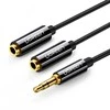 UGREEN AV123 AUX 3.5mm kištukas - 2x 3.5mm lizdai kabelis 0.25m juodas