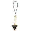 Dėklas Guess pakabukas GUCPMTDCK telefono dirželis Triangle Diamond Charm with Rhinestones