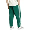 Kelnės vyrams adidas Essentials 3-Stripes Fleece Tapered Cuffed žalia KY4129 (2XL)