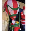 Dekoracja świąteczna Koopman Mikołaj w balonie dmuchany samopompujący zew 210CM LED