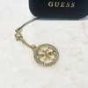 Dėklas Guess pakabukas GUCPM4DRD telefono dirželis 4G Rhinestone Charm