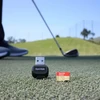 SanDisk Micro SD kortelė su USB adapteriu ant žolės