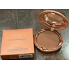 MAC Skinfinish Sunstruck Radiant Finish Bronzer kompaktiška pudra „Richer Golden“, 8 g