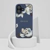 Dėklas Guess Grained Printed Flower Pattern MagSafe Apple iPhone 16 mėlynas