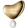 „Clarins“ brangusis auksinis veido masažo akmuo