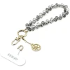 „Guess Universal Wrist Strap Crystals 4G Charm“ juodos spalvos