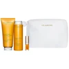 Set Clarins: Aroma, Essential Oils, Hydrating, Body Oil, 200 ml + Aroma, Essential Oils, Dušo želė, All Over The Body, 200 ml + Lip Confort, Lip Oil, 01, 1.4 ml *Miniature + Clarins, Zippered, GWP Textile Pouch, Baltas