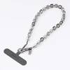 UNIQ Coehl Candy Gem Handstrap universali virvelė skirta telefonui ant rankos sidabro spalvos