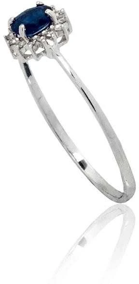 Auksinis žiedas su brangakmeniais. Metalas: Baltas Auksas. Praba: 585°. Akmuo: Briliantai , Safyras - 16.5 - 0.84 g. - Briliantai (0,037Ct), Safyras (0,305Ct)
