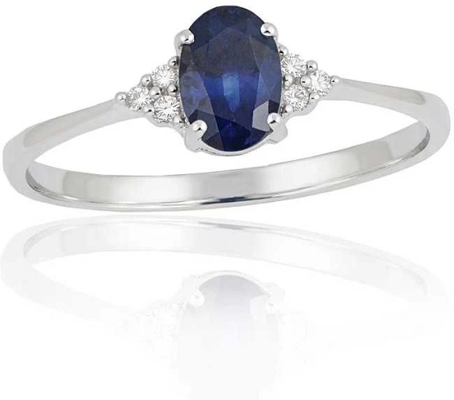 Auksinis žiedas su brangakmeniais. Metalas: Baltas Auksas. Praba: 585°. Akmuo: Briliantai , Safyras - 17 - 1.36 g. - Briliantai (0,036Ct), Safyras (0,658Ct)