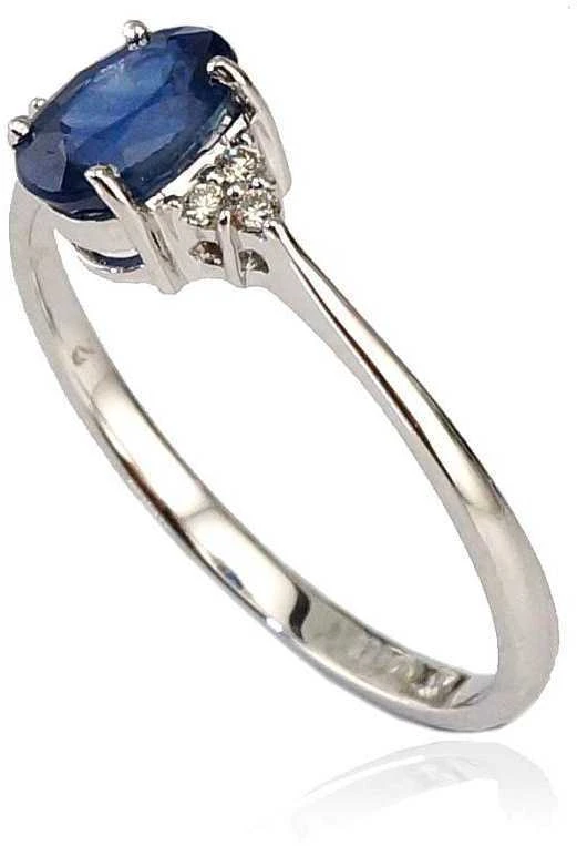 Auksinis žiedas su brangakmeniais. Metalas: Baltas Auksas. Praba: 585°. Akmuo: Briliantai , Safyras - 15.5 - 1.43 g. - Briliantai (0,04Ct), Safyras (0,526Ct)