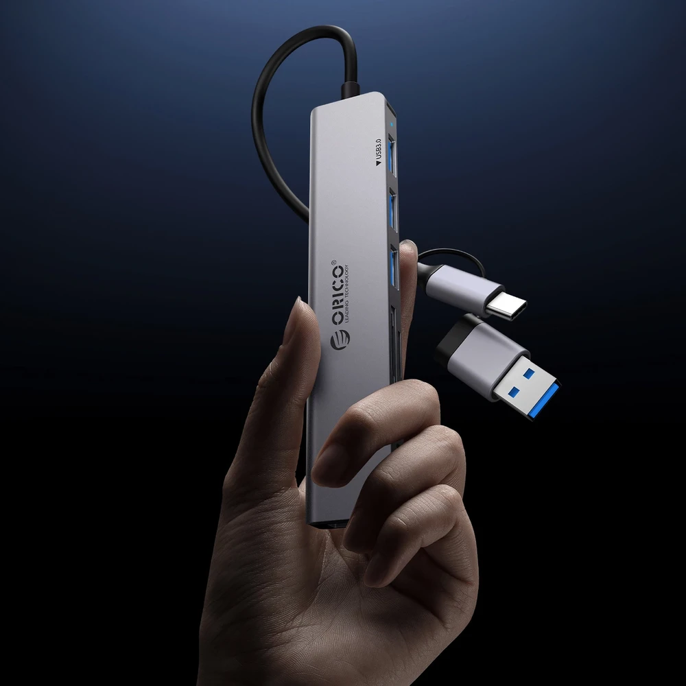 Orico YSB4-U2 USB-A/USB-C šakotuvo prijungimo stotelė 2x USB-A 2.0 + 1x USB-A 3.0 + 1x USB-C 2.0 + 1x USB-C – pilkos spalvos