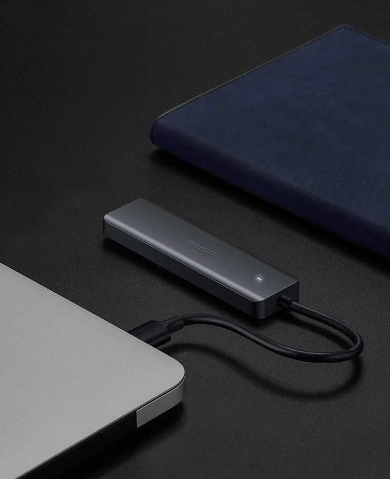 4-in-1 adapteris UGREEN USB Hub prie 4x USB 3.0 + USB-C (pilka)