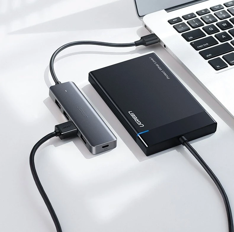 4-in-1 adapteris UGREEN USB Hub prie 4x USB 3.0 + USB-C (pilka)