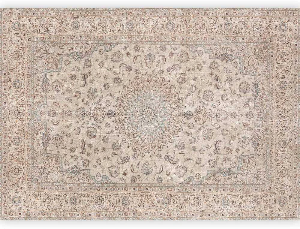 Artgeist Fototapetas - Sand carpet - worn Persian carpet with rich decorative motifs