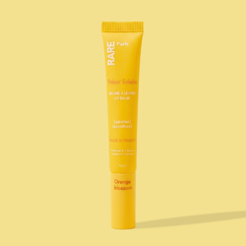 Rare Paris Trésor Solaire Soothing Lūpų balzamas Oranžinis Blossom Scent lūpų balzamas su vitaminu E ir arnikos ekstraktu, 12 ml