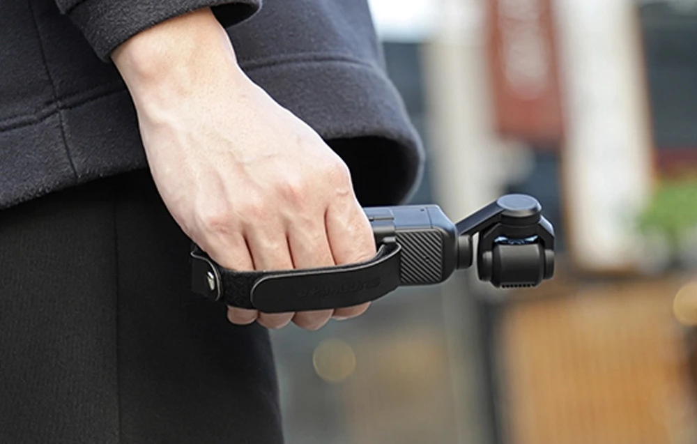 Rankinė juosta ir rankena Sunnylife, skirta DJI OSMO Pocket 3 aprašymas - Prekės nuotrauka Rankinė juosta ir rankena Sunnylife, skirta DJI OSMO Pocket 3 aprašymas - Prekės nuotrauka
