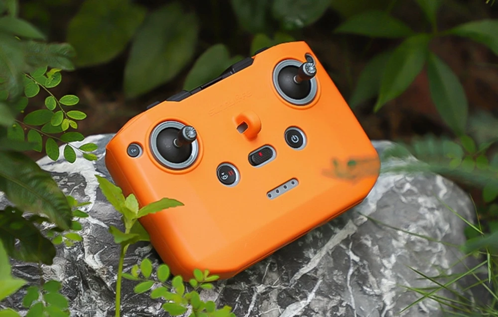 Sunnylife silikoninis dėklas, skirtas DJI RC-N1 / RC-N2 / RC-N3 (oranžinė) aprašymas - Prekės nuotrauka
