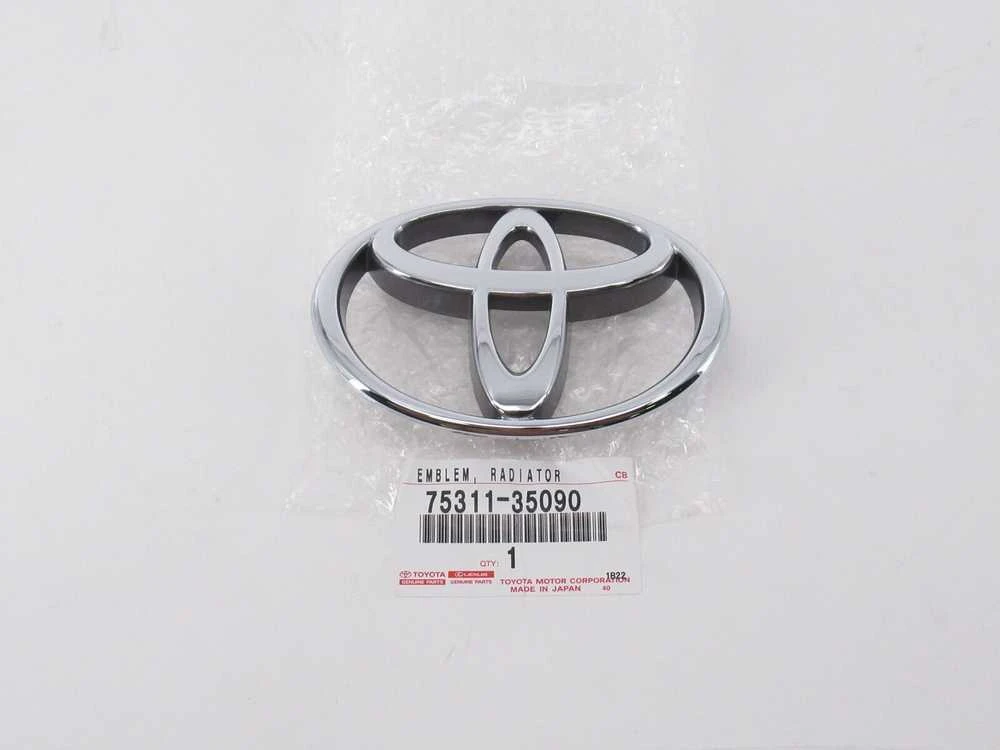 AUTENTIŠKAS TOYOTA 4RUNNER TACOMA T100 PICKUP PRIEKINIS GROTELIŲ CHROMO EMBLEMA 75311-35090