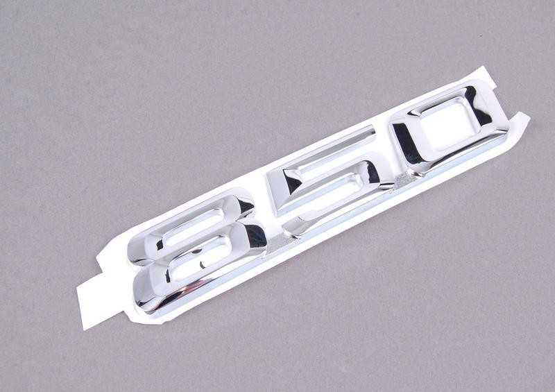 BMW E31 emblema, priklijuota prie galinės dalies, originali 51148152850