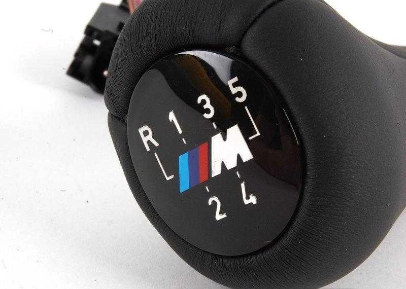 BMW E34 E36 greičio emblema perjungimo rankenėlės rankena 25112231550 Originali