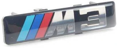 BMW E46 priekinio sparno apdailos grotelių emblema Originali 72127900605