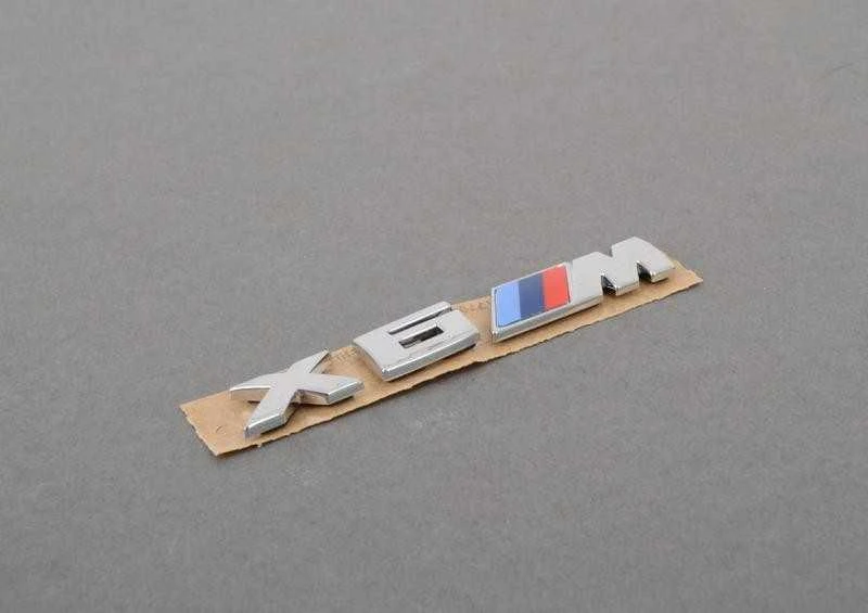 BMW F86 Radiatoriaus inksto grotelės M emblema kairė originali 51138063150