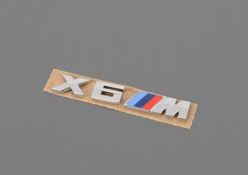 BMW F86 Radiatoriaus inksto grotelės M emblema kairė originali 51138063150