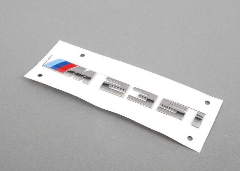 BMW ORIGINALUS F23 2 SERIJOS M235i CHROMO BAGAŽO ŽENKLAS EMBLEMA M SPORT 8055967