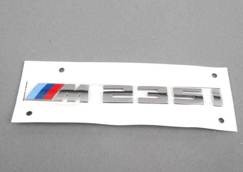 BMW ORIGINALUS F23 2 SERIJOS M235i CHROMO BAGAŽO ŽENKLAS EMBLEMA M SPORT 8055967