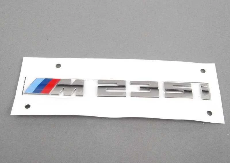 BMW ORIGINALUS F23 2 SERIJOS M235i CHROMO BAGAŽO ŽENKLAS EMBLEMA M SPORT 8055967