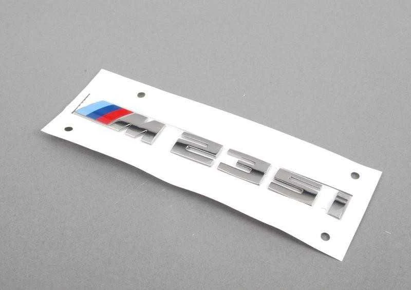 BMW ORIGINALUS F23 2 SERIJOS M235i CHROMO BAGAŽO ŽENKLAS EMBLEMA M SPORT 8055967