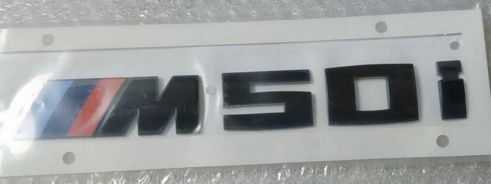 BMW X6 G06 blizgus juodas bagažinės ženkliukas M50i originalus 51142472842