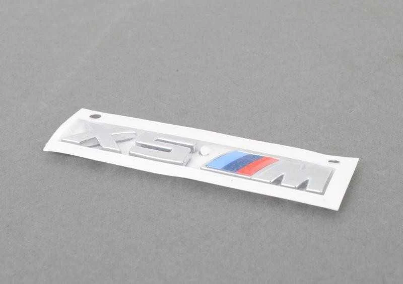 Originalus BMW X5M F85 radiatoriaus inksto grotelių M emblema kairėje OEM 51138063149