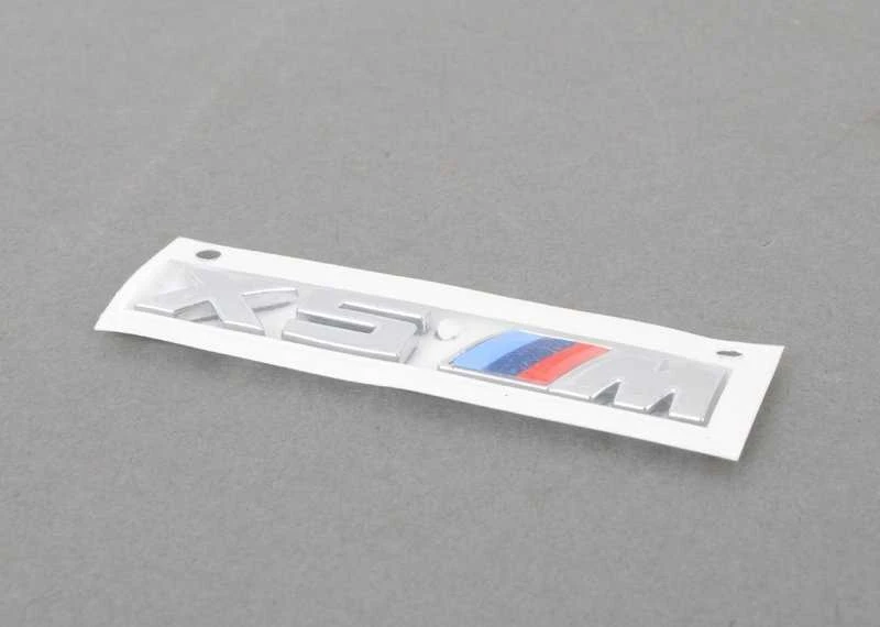 Originalus BMW X5M F85 radiatoriaus inksto grotelių M emblema kairėje OEM 51138063149