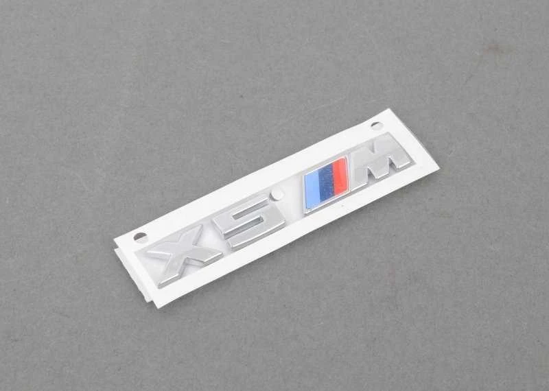 Originalus BMW X5M F85 radiatoriaus inksto grotelių M emblema kairėje OEM 51138063149