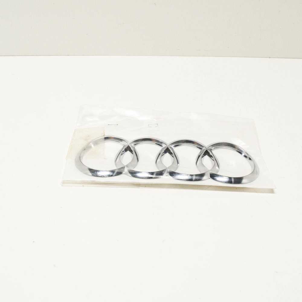VAG AUDI A5 8W6 Galiniai bagažinės dangčio emblemos žiedai 8W88537422ZZ NAUJA ORIGINALI