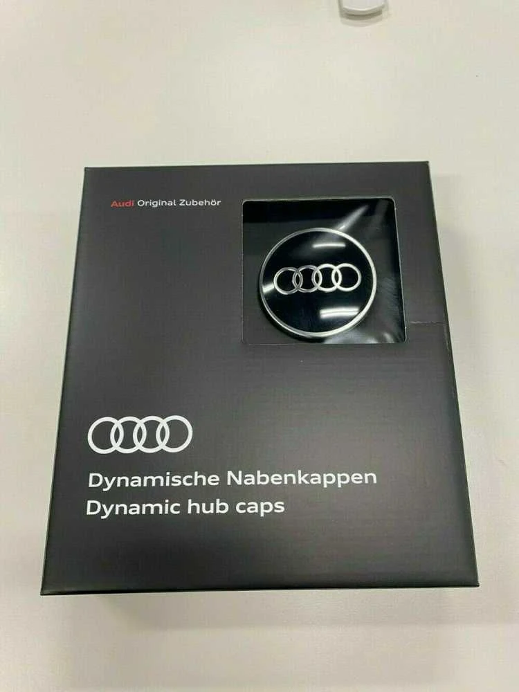 VAG "Audi Dynamic" besisukantis centrinis stebulės dangtelis juodas originalus 4M8071006A