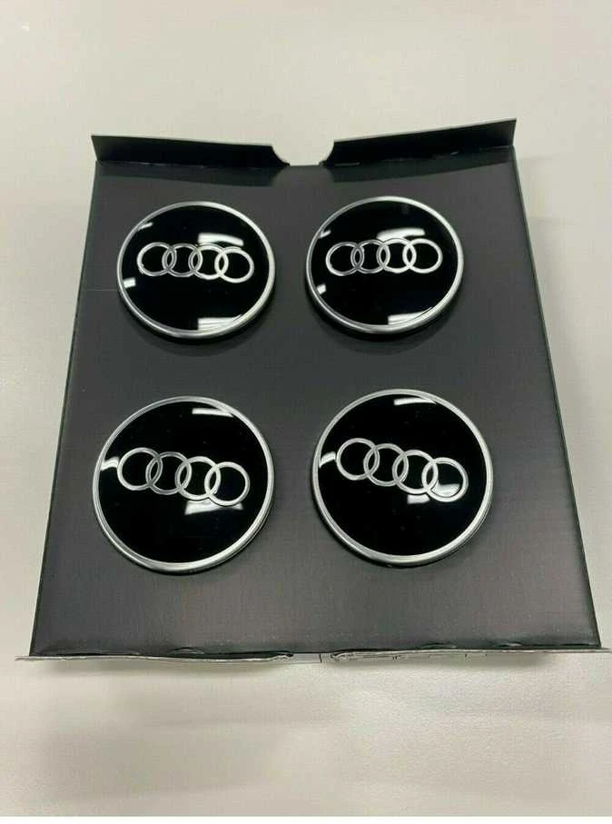 VAG "Audi Dynamic" besisukantis centrinis stebulės dangtelis juodas originalus 4M8071006A