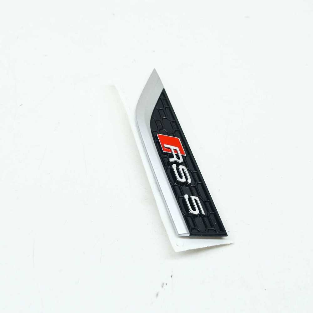 VAG NAUJAS AUDI RS5 8W6 PRIEKINIS KAIRĖS PUSĖS KREIVĖS EMBLEMA ŽENKLAS 8W6853601DPUZ ORIGINALUS