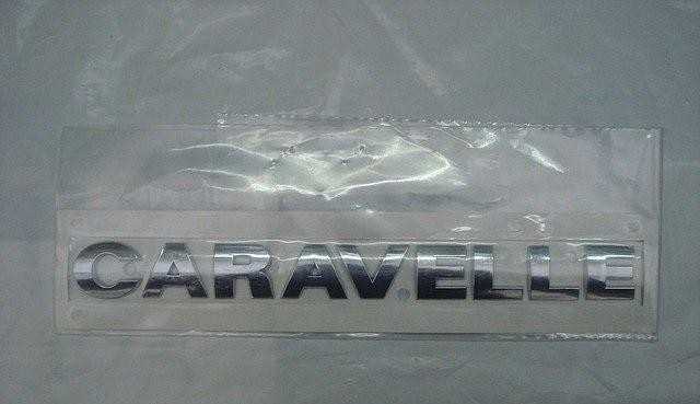 VAG Naujas originalus VW TRANSPORTER (03-11) galinis bagažinės \"CARAVELLE\" užrašas B