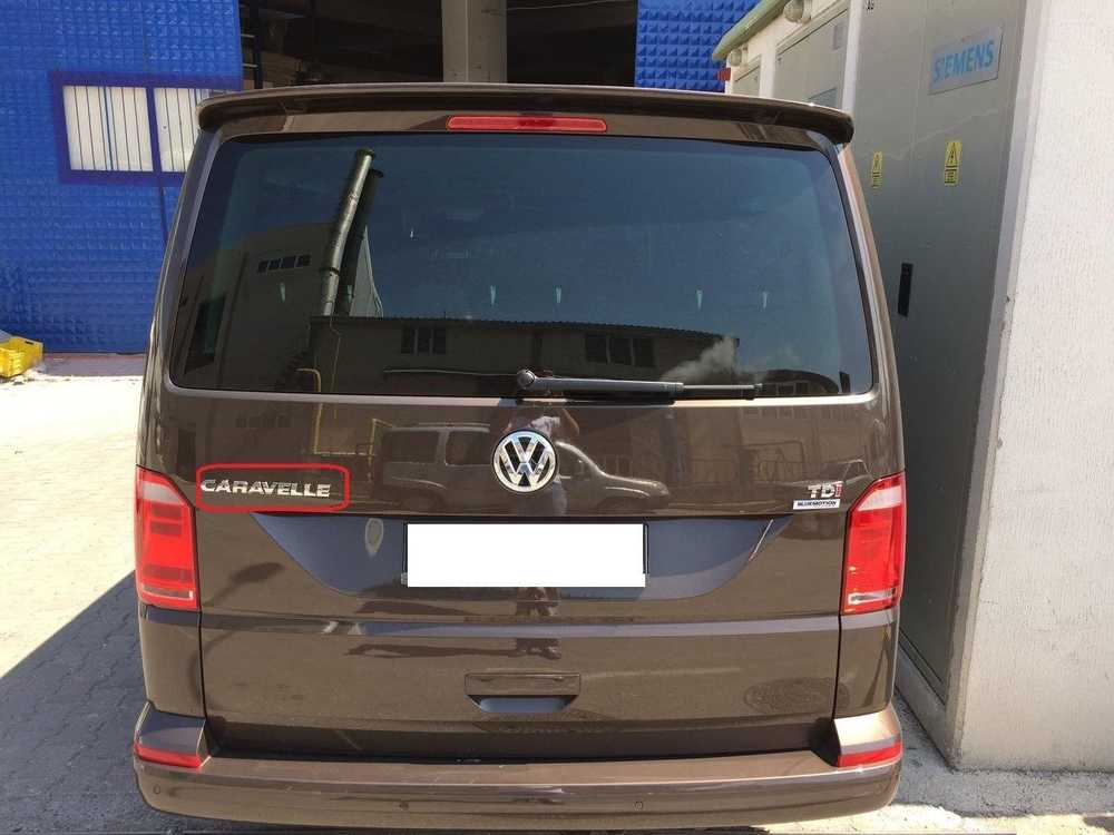 VAG Naujas originalus VW TRANSPORTER (03-11) galinis bagažinės \"CARAVELLE\" užrašas B