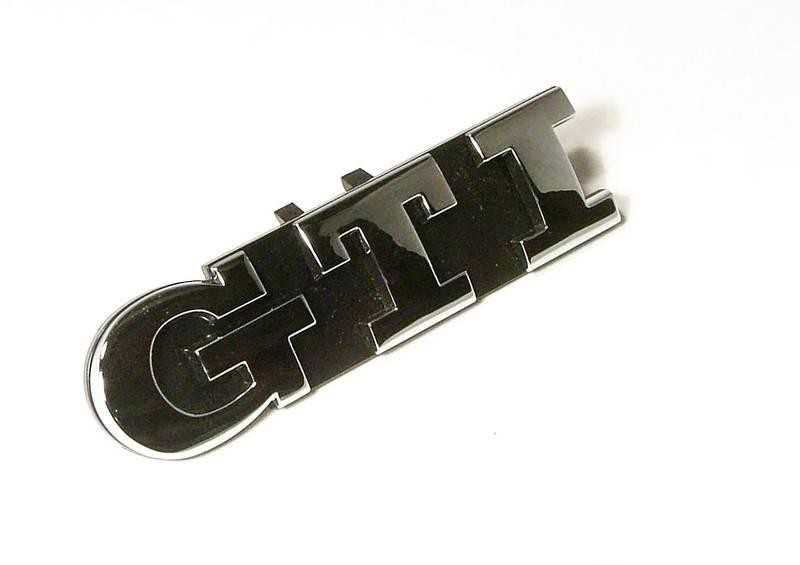 VAG VW Golf grotelių emblema su GTI užrašu originali 1K6853679D