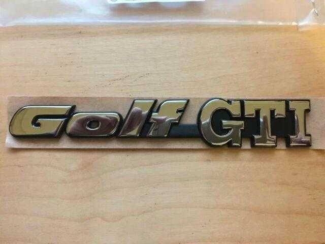 VAG VW Golf Mk3 galinė emblema originali 1H6853687ADZ10